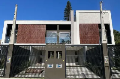 Sobrado geminado no bairro anita garibaldi com suíte