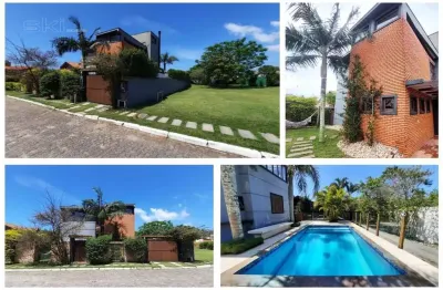 Casa 3 suítes em condomínio fechado a venda por r$ 3.990.000 com 450 m²