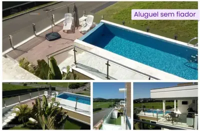 Casa 4 suítes e 6 banheiros para alugar, 560 m² por r$ 23.000/mês