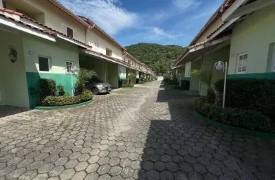 Casa em condomínio fechado no centro de monagaguá 2 dorrmitórios