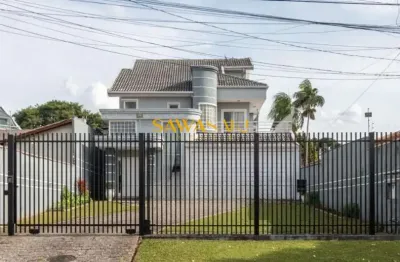 Sobrado alto padrão individual com frente para a rua no coração do guabirotuba contendo 5 quartos