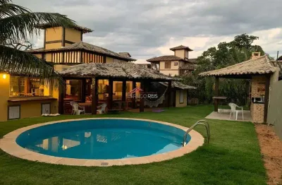 Vende casa em condomínio 04 suítes e area privativa com piscina e churrasqueira a 50m da praia de manguinhos