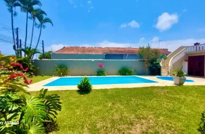 Casa na praia com piscina e 4 quartos em peruíbe - r$ 970.000,00.