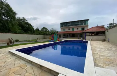 Casa com 3 quartos, piscina, área gourmet e lago em peruíbe - r$ 650.000,00.
