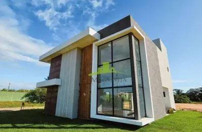 Casa à venda em guarajuba: 4 suítes, piscina com hidromassagem, área gourmet, nascente total, 192m² de área construída. condomínio canto de guarajuba.