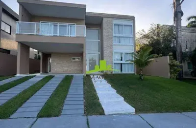 Alphaville litoral norte 1. casa à venda com 290m², 4 suítes, piscina privativa, nascente total, espaço gourmet, acabamento premium. alto padrão.