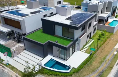 Casa nova em condomínio fechado vista lagoa com 4 suítes