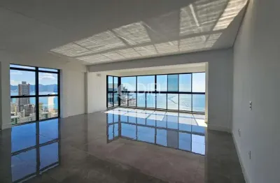 Frente para  avenida apto com 4 suítes e 3 vagas, meia praia, itapema - sc