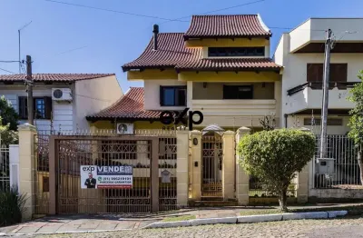 Casa com 4 quartos à venda na avenida pereira pinto, 215, jardim são pedro, porto alegre por r$ 1.185.000