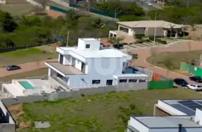 Terreno em condomínio fechado à venda na rua sérgio bortolotto, 220, loteamento parque dos alecrins, campinas por r$ 597.000