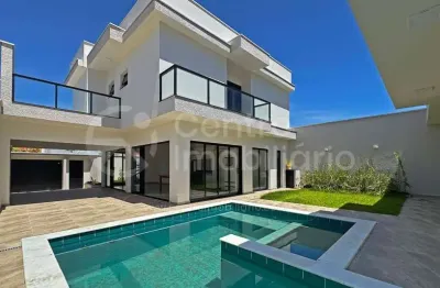 Casa à venda com piscina e 4 quartos em peruíbe, no bairro jardim imperador