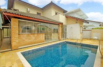 Casa à venda com piscina e 4 quartos em peruíbe, no bairro jd tres marias