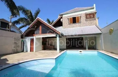 Casa à venda com piscina e 4 quartos em peruíbe, no bairro centro
