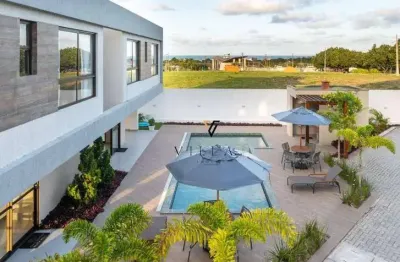 Casa em condomínio com 3 dormitórios, sala para 2 ambientes, cozinha americana e varanda à venda, 112 m² por r$ 615.000 - enseada de jacumã - conde/pb