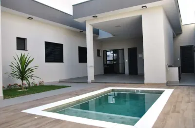 Casa térrea no condomínio d lucila, 3 suítes, piscina aquecida, cozinha com planejados e cooktop, área gourmet com churrasqueira e planejados
