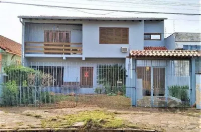 Casa com 3 quartos à venda na Rua Vítor Valpírio, 489, Anchieta, Porto Alegre