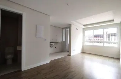 Apartamento 1 dormitório com suíte, cozinha americana, lavabo e amplo living no