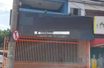 Salão comercial com apartamento e estacionamento a venda