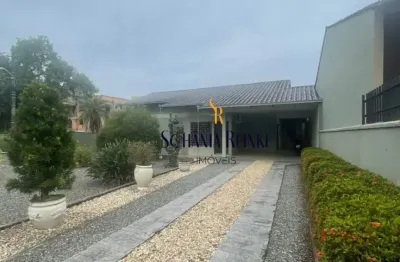 Casa com piscina averbada iririú com 1 suíte mais dois dormitórios