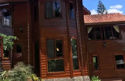 Casa de Condomínio para venda e aluguel em Cumbari de 400.00m² com 4 Quartos, 2 Suites e 2 Garagens