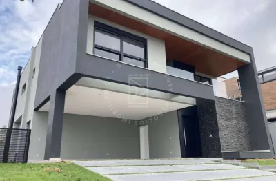 Casa em condomínio fechado, 5 suítes, 397m2, 4 vagas.