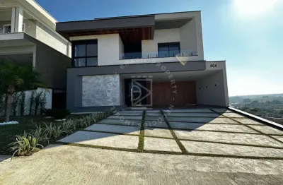 Casa em condomínio fechado, 4 suítes, ambientes integrados, 283m2, 4 vagas.