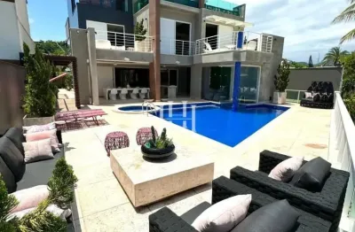 Casa contemporânea com 4 suítes e lazer completo em camboinhas ca