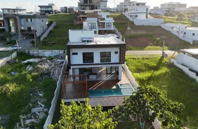 Alphaville litoral norte iii – casa triplex com arquitetura sofisticada e alto padrão de acabamento