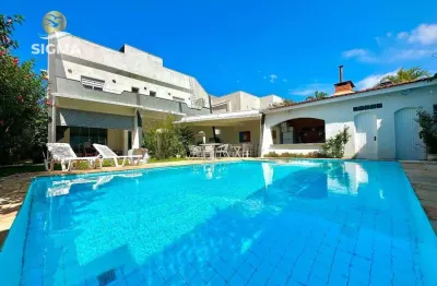 Casa em condomínio fechado com 4 suítes - área de lazer com piscina e churrasqueira - 4 vagas - jardim acapulco - guarujá/sp.