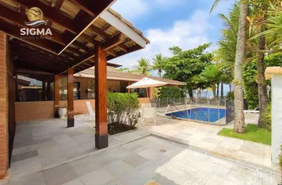 Casa na praia, frente mar, 4 suítes, piscina, 6 vagas, enseada, guarujá.