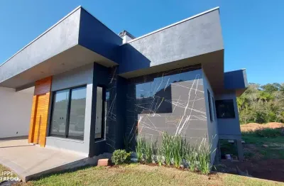 Casa nova plana com dois dormitórios, bairro beira rio em dois irmãos, rs.