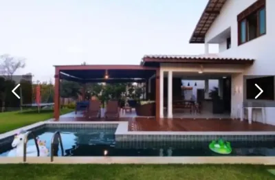 Vendo ou alugo casa de alto padrao , com 5/4, sendo 05 suítes, área privativa de 380 m2 no condomínio ilha dos pássaros - na praia do forte