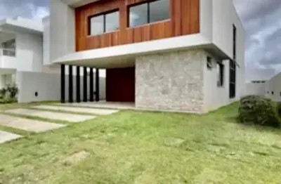 Vendo casa de 4/4, sendo 03 suites, com area privativa de 280  m², infraestrutura de clube completa - localização privilegiada - no condomínio  alphaville litoral norte 2 - na estrada do coco