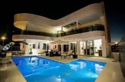 Casa em condomínio fechado com 5 quartos à venda na rua das caraúnas, 463, jurerê internacional, florianópolis, 739 m2 por r$ 12.000.000