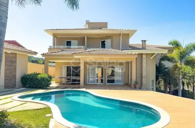 Casa em condomínio à venda de esquina, porteira fechada; com quatro dormitórios e lazer privativo no condomínio terras de santa teresa - itupeva/sp