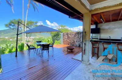 Linda casa com incrível vista para o mar no condomínio alto da praia vermelha em ubatuba sp