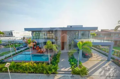 Viva o alto luxo: casa exclusiva com 5 suítes no condomínio morada da praia ii!