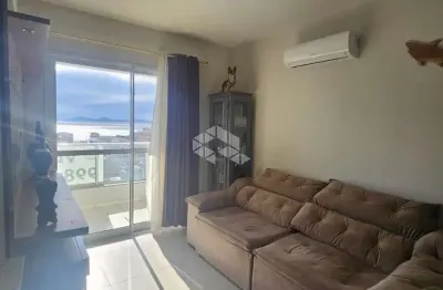 Apartamento no bairro barreiros, em são josé, sc, vista mar, semi-mobiliado, sacada, churrasqueira, 03 quartos sendo 01 suíte, 01 vaga de garagem