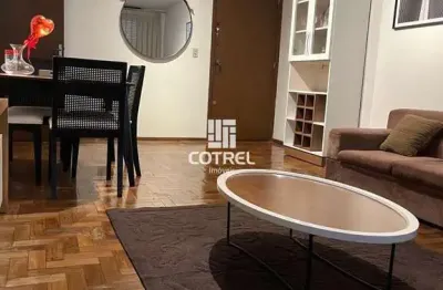 Apartamento mobiliado com 2 dormitórios, suíte, dependência e garagem