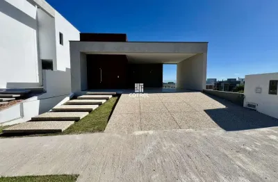 Casa para venda, 3 suítes, 2 vagas de garagem, situada no condomínio fechado rea