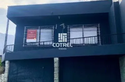 Casa comercial para locação 5 salas, 2 vagas de garagem situada no bairro centro