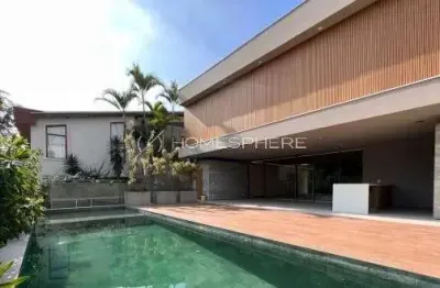Casa contemporânea à venda no alphaville 1 assinada por rodrigo latorre com 4 suítes e área gourmet