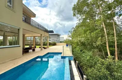 Casa de alto padrão à venda no residencial itahyê alphaville com 4 suítes e vista para a mata