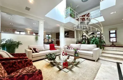 Casa a venda em aldeia da serra com 5 suites, piscina e varanda gourmet