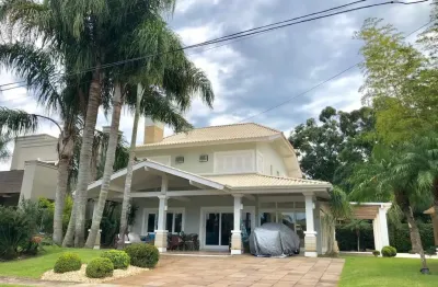 Casa em condomínio fechado com 5 quartos à venda na avenida interbalneários, 436, atlântida, xangri-lá, 240 m2 por r$ 2.810.000
