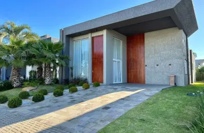 Casa em condomínio fechado com 4 quartos à venda na rua onório germano, 2009, araça, capão da canoa, 200 m2 por r$ 1.850.000