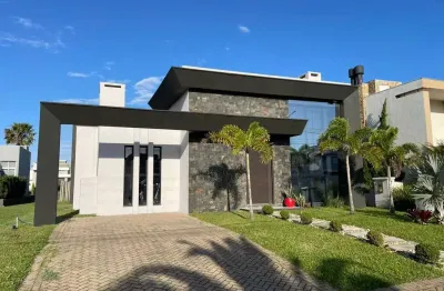Casa em condomínio fechado com 3 quartos à venda na rua onório germano, 2009, araça, capão da canoa por r$ 1.200.000