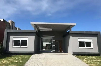 Casa em condomínio fechado com 4 quartos à venda na rua onório germano, 2009, araça, capão da canoa por r$ 1.560.000