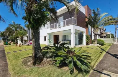 Casa em condomínio fechado com 5 quartos à venda na avenida central, 11, zona nova, capão da canoa por r$ 1.800.000