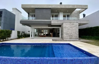 Casa em condomínio fechado com 5 quartos à venda na rua rio jacuí, 1331, atlântida, xangri-lá, 325 m2 por r$ 5.000.000